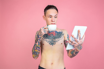 Image showing Portrait of young man with freaky appearance on pink background