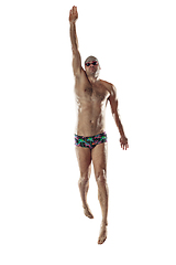 Image showing Professional male swimmer with hat and goggles in motion and action, healthy lifestyle and movement concept