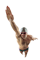 Image showing Professional male swimmer with hat and goggles in motion and action, healthy lifestyle and movement concept