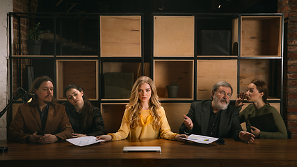 Image showing Young colleagues working together in a office styled like classical artworks. Look busy, attented, cheerful, successful. Concept of business, office, finance.