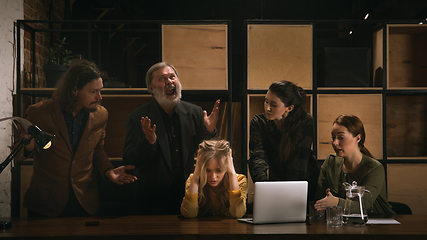 Image showing Young colleagues working together in a office styled like classical artworks. Look busy, attented, cheerful, successful. Concept of business, office, finance.