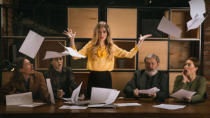 Image showing Young colleagues working together in a office styled like classical artworks. Look busy, attented, cheerful, successful. Concept of business, office, finance.