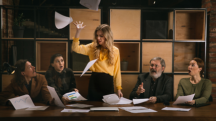 Image showing Young colleagues working together in a office styled like classical artworks. Look busy, attented, cheerful, successful. Concept of business, office, finance.