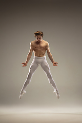 Image showing Young and graceful ballet dancer isolated on studio background. Art, motion, action, flexibility, inspiration concept.