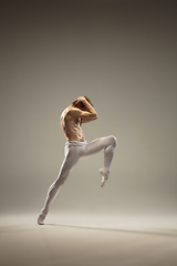 Image showing Young and graceful ballet dancer isolated on studio background. Art, motion, action, flexibility, inspiration concept.