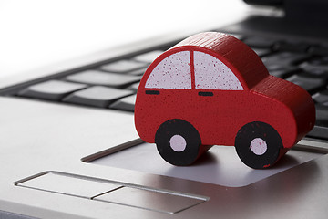 Image showing toy car on a laptop