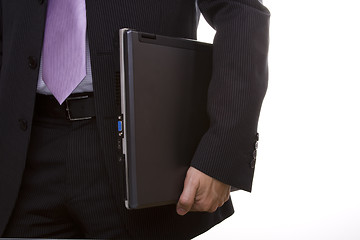 Image showing businessman holding a laptop