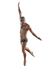 Image showing Professional male swimmer with hat and goggles in motion and action, healthy lifestyle and movement concept