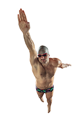 Image showing Professional male swimmer with hat and goggles in motion and action, healthy lifestyle and movement concept