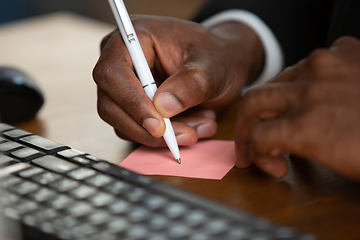 Image showing African-american entrepreneur, businessman working concentrated in office