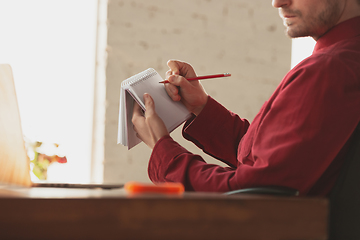 Image showing Caucasian entrepreneur, businessman, manager working in office, close up