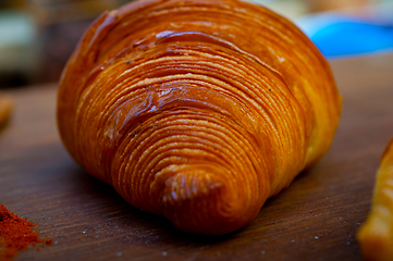 Image showing french traditiona croissant brioche butter bread  on wood