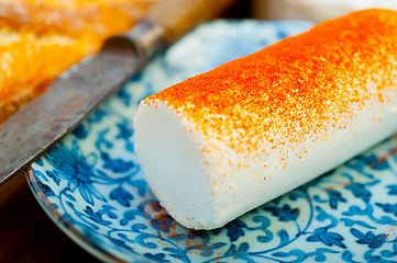 Image showing French cheese and fresh  baguette on a wood cutter