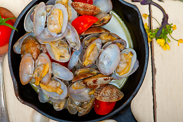 Image showing fresh clams on an iron skillet