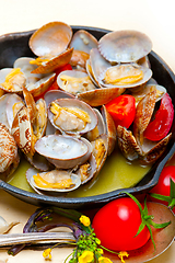 Image showing fresh clams on an iron skillet