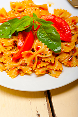 Image showing Italian pasta farfalle butterfly bow-tie and tomato sauce