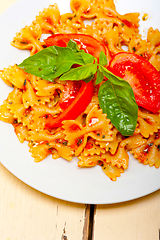 Image showing Italian pasta farfalle butterfly bow-tie and tomato sauce