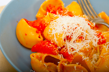 Image showing Italian snail lumaconi pasta with tomatoes