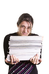 Image showing Woman with a pile of books