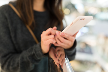 Image showing Woman use of smart phone in shopping mall