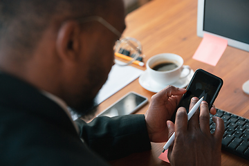 Image showing African-american entrepreneur, businessman working concentrated in office