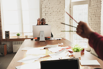 Image showing Caucasian entrepreneur, businessman, manager trying to work, looks funny, lazy and spending time