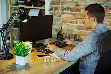 Image showing Man working from home during coronavirus or COVID-19 quarantine, remote office concept