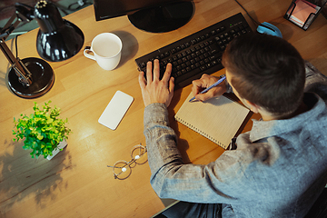 Image showing Man working from home during coronavirus or COVID-19 quarantine, remote office concept