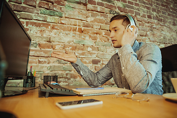 Image showing Man working from home during coronavirus or COVID-19 quarantine, remote office concept