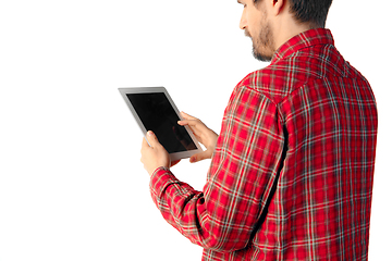 Image showing Close up of man using tablet with blank screen isolated on white studio background