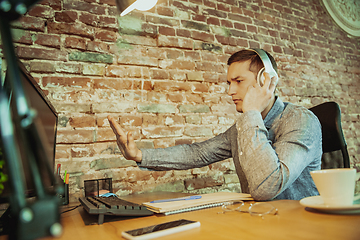 Image showing Man working from home during coronavirus or COVID-19 quarantine, remote office concept