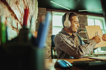 Image showing Man working from home during coronavirus or COVID-19 quarantine, remote office concept