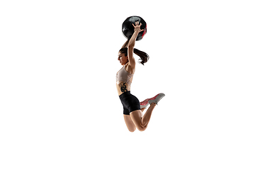 Image showing Caucasian professional female athlete training isolated on white studio background. Muscular, sportive woman.