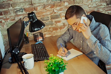 Image showing Man working from home during coronavirus or COVID-19 quarantine, remote office concept