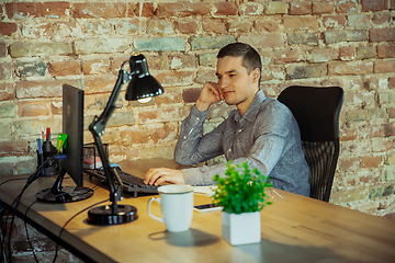 Image showing Man working from home during coronavirus or COVID-19 quarantine, remote office concept