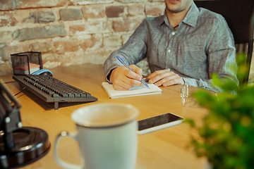 Image showing Man working from home during coronavirus or COVID-19 quarantine, remote office concept