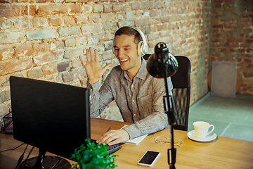 Image showing Man working from home during coronavirus or COVID-19 quarantine, remote office concept