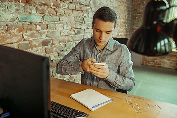 Image showing Man working from home during coronavirus or COVID-19 quarantine, remote office concept