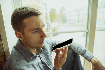 Image showing Man working from home during coronavirus or COVID-19 quarantine, remote office concept