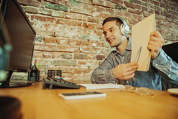 Image showing Man working from home during coronavirus or COVID-19 quarantine, remote office concept