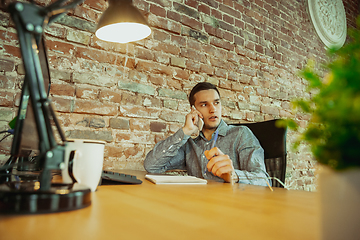 Image showing Man working from home during coronavirus or COVID-19 quarantine, remote office concept