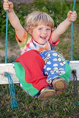 Image showing A girl on the swing