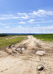 Image showing sandy road puddle