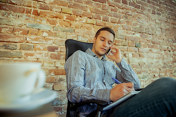 Image showing Man working from home during coronavirus or COVID-19 quarantine, remote office concept