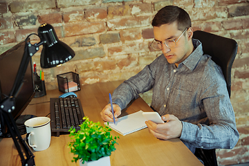 Image showing Man working from home during coronavirus or COVID-19 quarantine, remote office concept