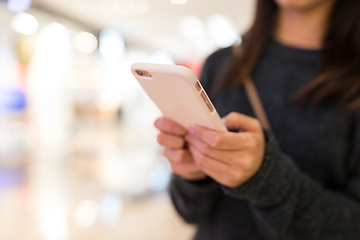 Image showing Woman using cellphone for online