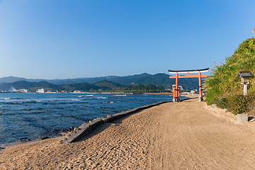 Image showing Aoshima Island and japanese torii with sunshine