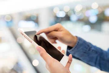 Image showing Woman working on cellphone