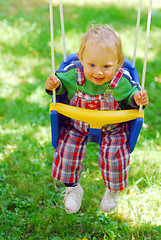 Image showing A girl on the swing