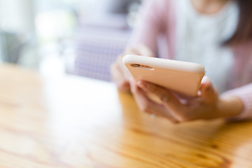 Image showing Woman using mobile phone for online